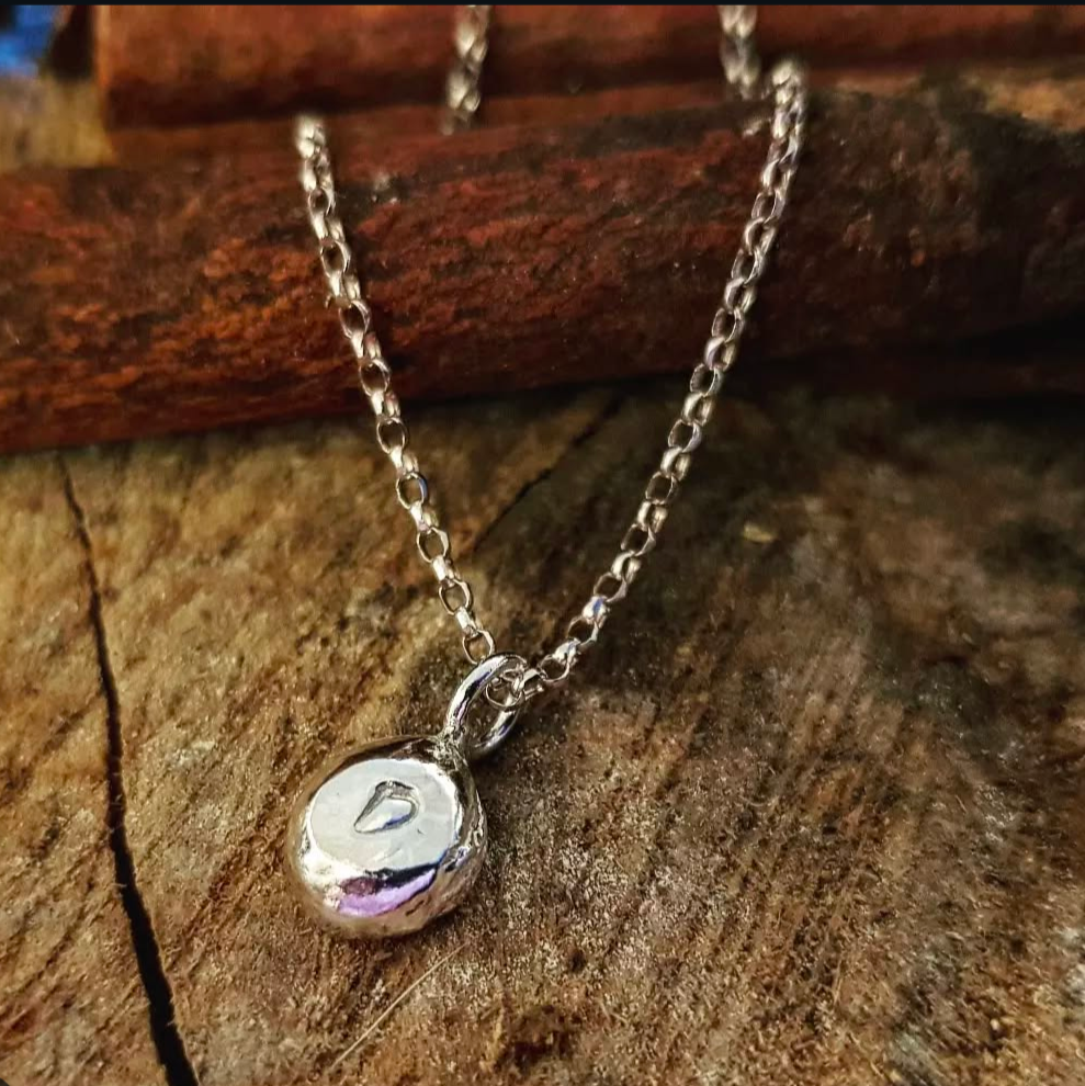 Storyteller Charm - A little symbol with meaning.