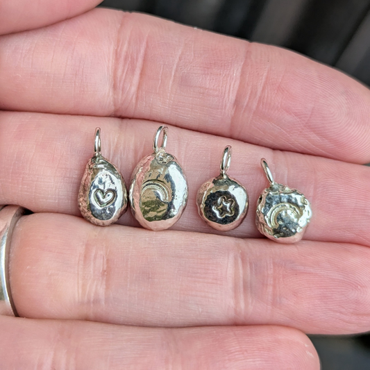 Storyteller Charm - A little symbol with meaning.