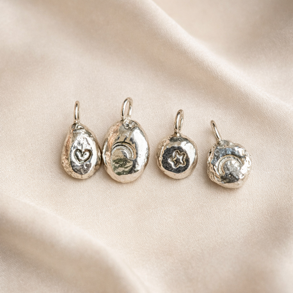 Storyteller Charm - A little symbol with meaning.