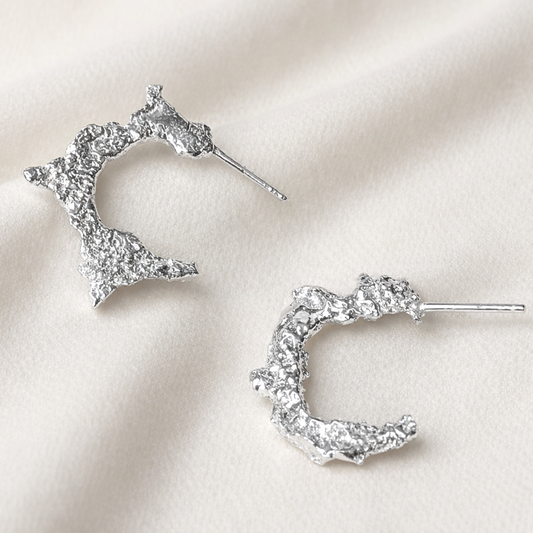 Edge Of The Moon handmade sterling silver earrings with organic texture, inspired by the Snow Moon